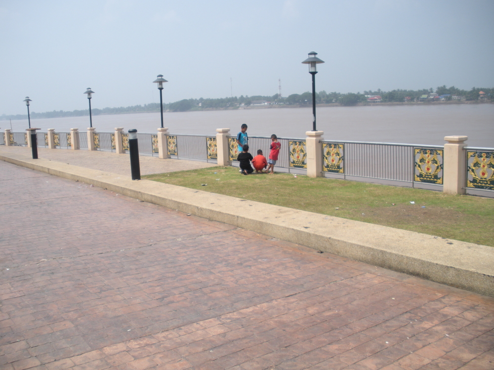 Little Boys shooting off fireworks Along The Mekong